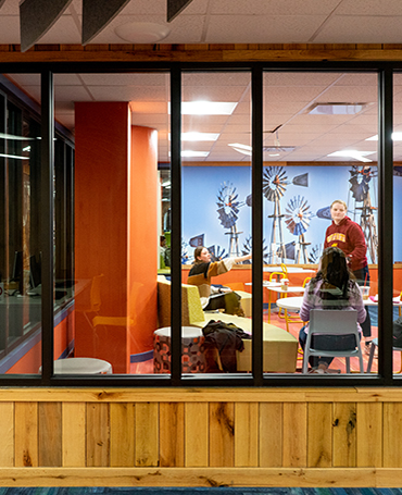 Three students studying together inside of Moffett Library.