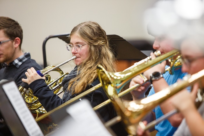 Music students playing their instruments during class.