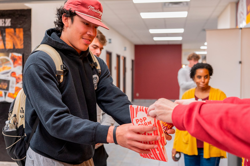 A student with popcorn during Maroon March