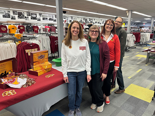 Faculty and staff posing inside of the MSU Texas bookstore during the popup on March 16, 2023.