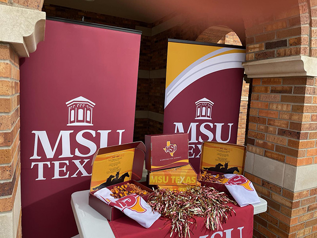 MSU Texas Maroon March merchandise resting on a table outside of Prothro-Yeager at the first Maroon March popup on March 1, 2023.