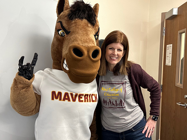 Maverick the Mustang posing with Dr. Curry at the West College of Education, March 3, 2023.