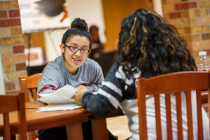 A student getting help with paperwork