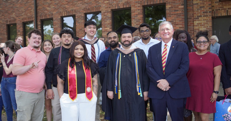 Dean Forrester with graduates