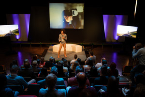 Speaker in front of a crowd
