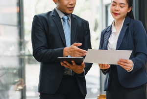 Photo of two businesspeople talking