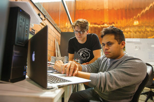 Two Students Looking at a Computer Screen