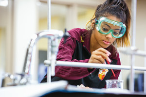 A young lady in a lab doing research