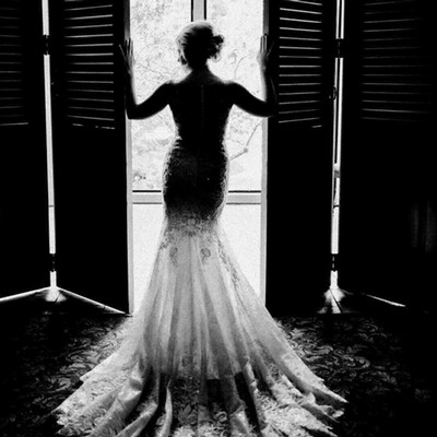 Woman in a wedding dress, back to the camera