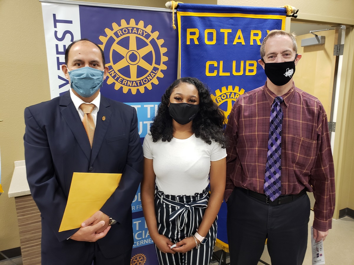 Dr. Martin Camacho, Khirstia Sheffield, and Dr. Jim Sernoe accepting the Rotary North Scholarship for this year.
