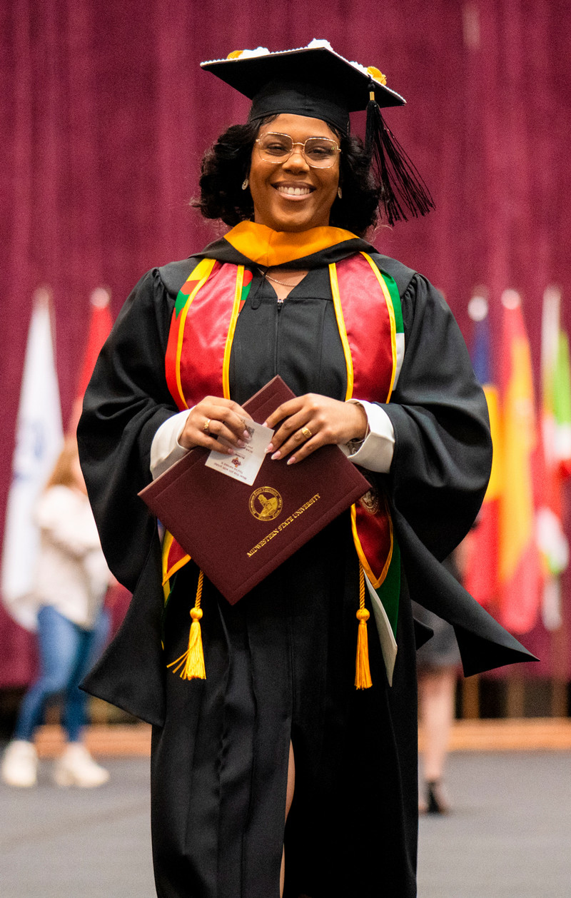 MSU graduate walking down the aisle