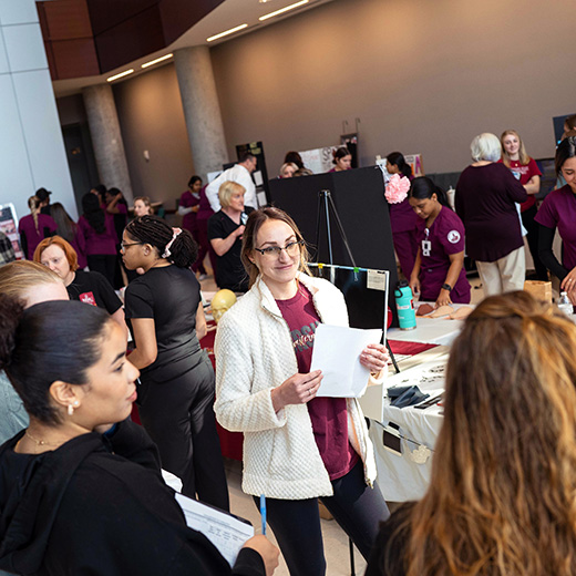 Various groups of Health Sciences and Human Services MSU Texas students are gathered in the lobby of Centennial Hall during the Health Fair Event.