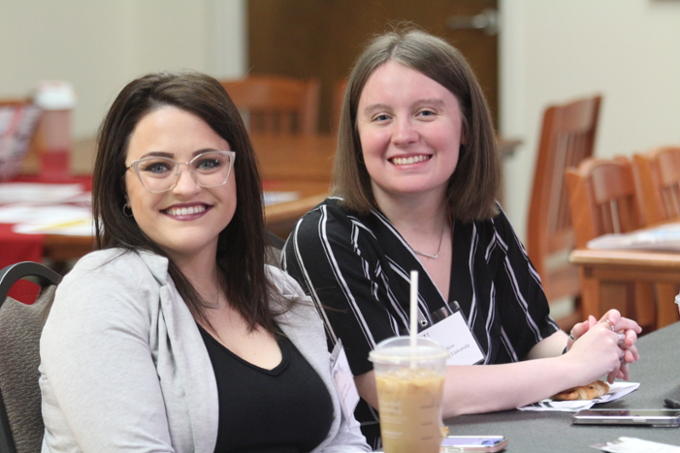 Two students at a conference hosted in the Clark Student Center.