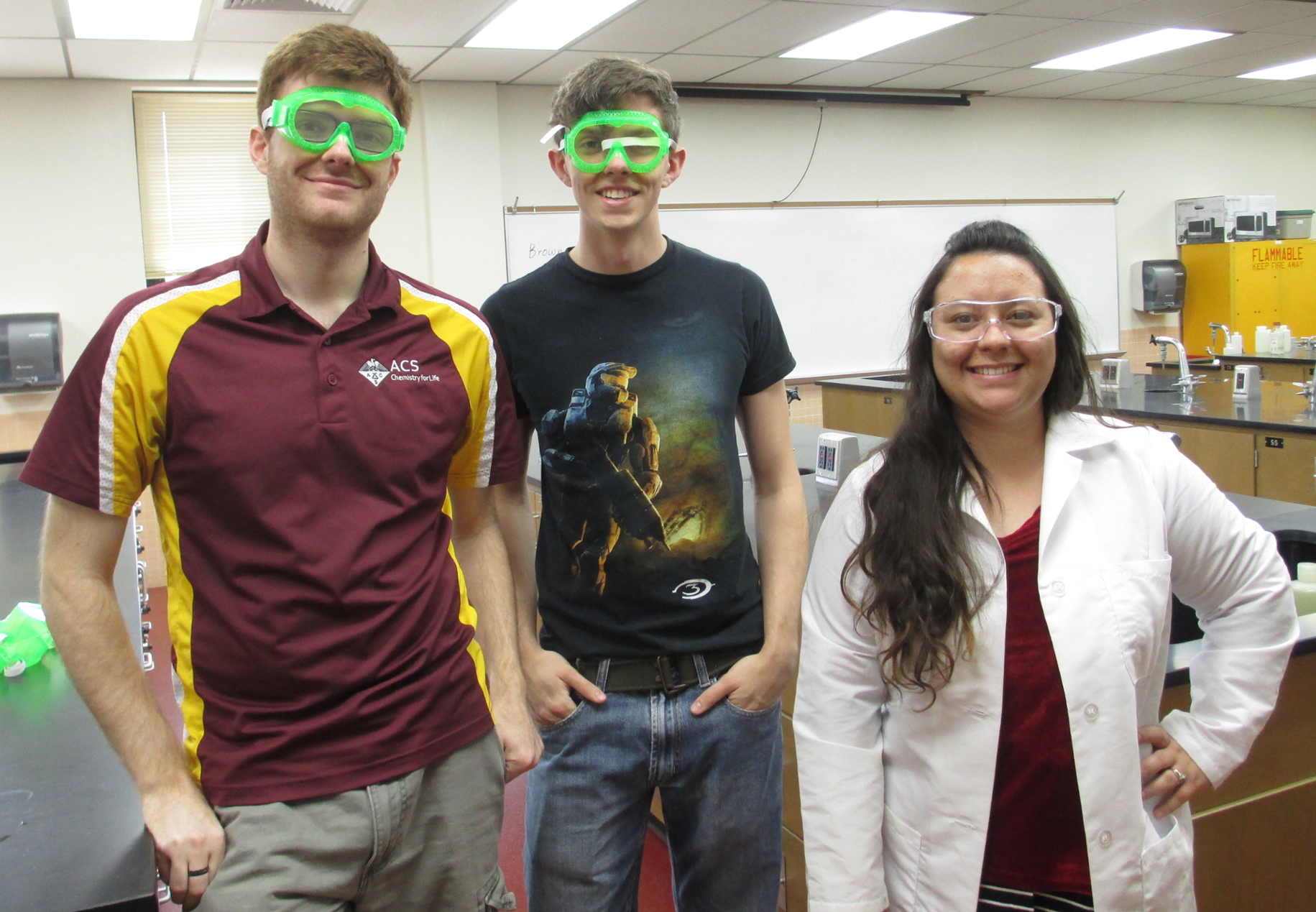 Three Chemistry students standing together smiling in a lab inside Bolin at Midwestern State University.