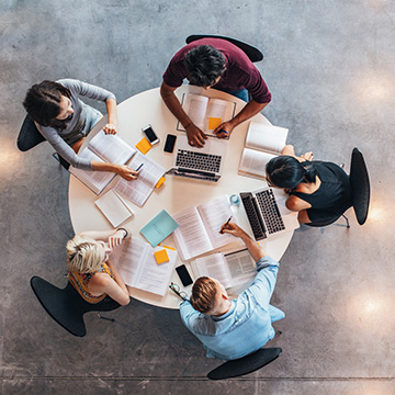 Five university students work together during group study.