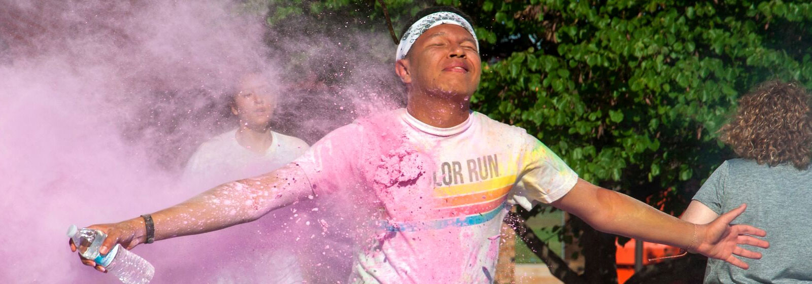 Student getting hit with powder in color run