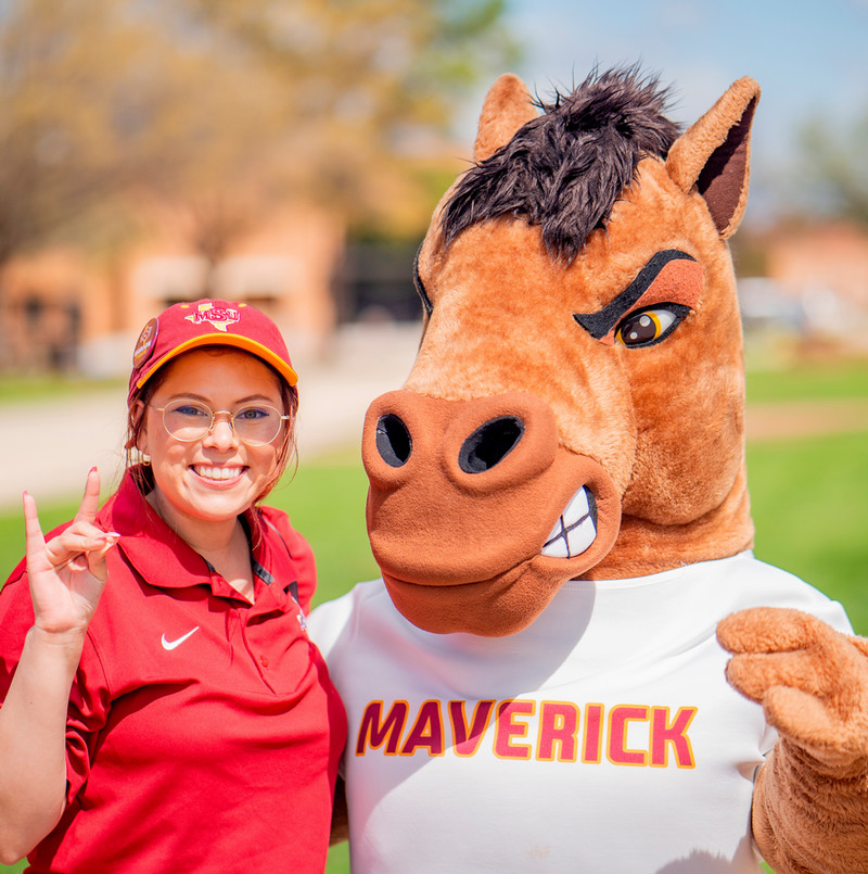 A student with mascot Maverick