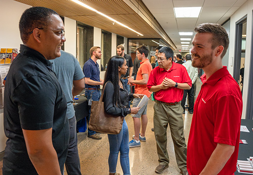 Students engage with employers during the Career Fair hosted by the Career Management Center.