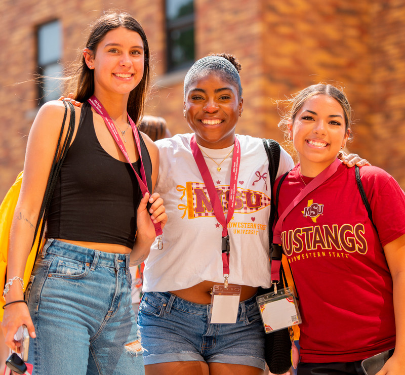 Three MSU students smiling