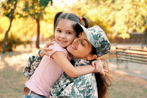 A female soldier with a child