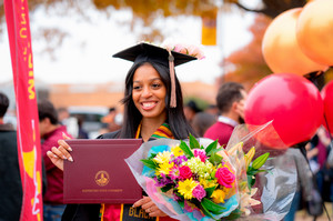 A female student with a diploma