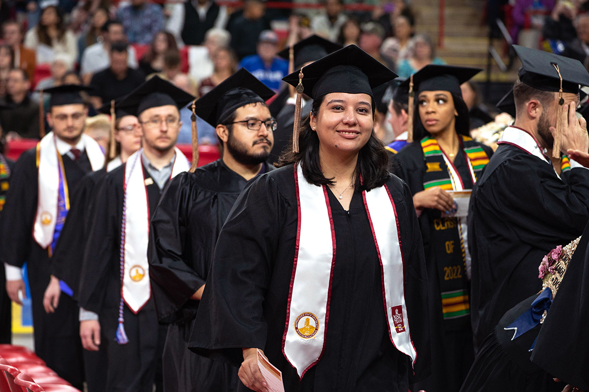 Students walking to their seats for the fall 2022 MSU Texas commencement ceremony.
