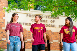 Three Students Walking and Smiling