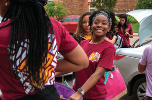 A student smiling