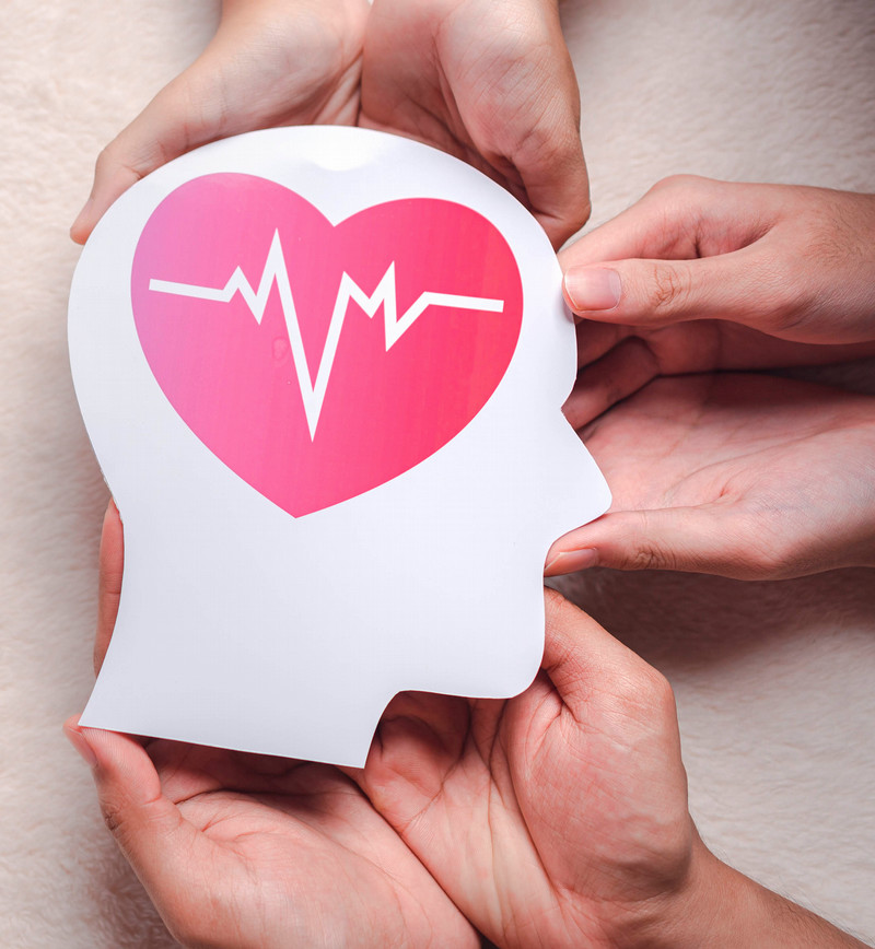 Mental health graphic showing hands and a depiction of a human head