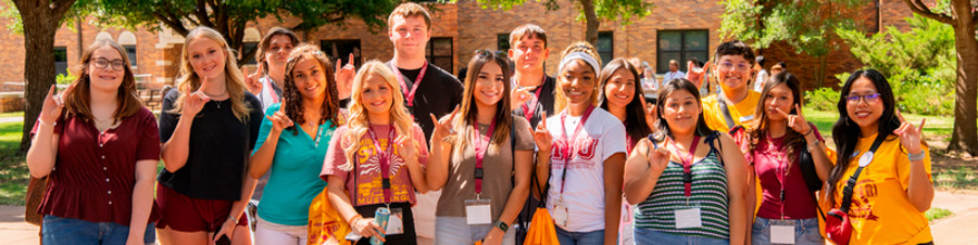 A group of MSU students with stangs up