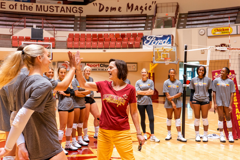 President Haynie with members of the MSU women's basketball team