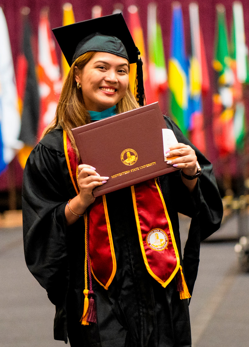MSU graduate with diploma