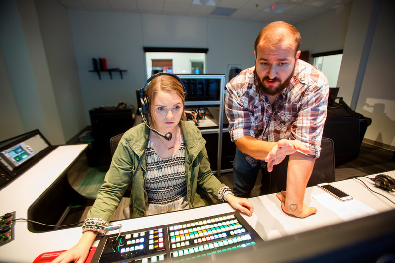 Student and teacher in a production studio