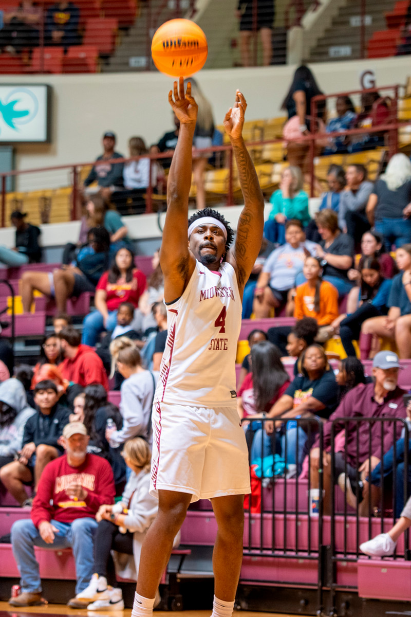 MSU basketball player shooting the ball
