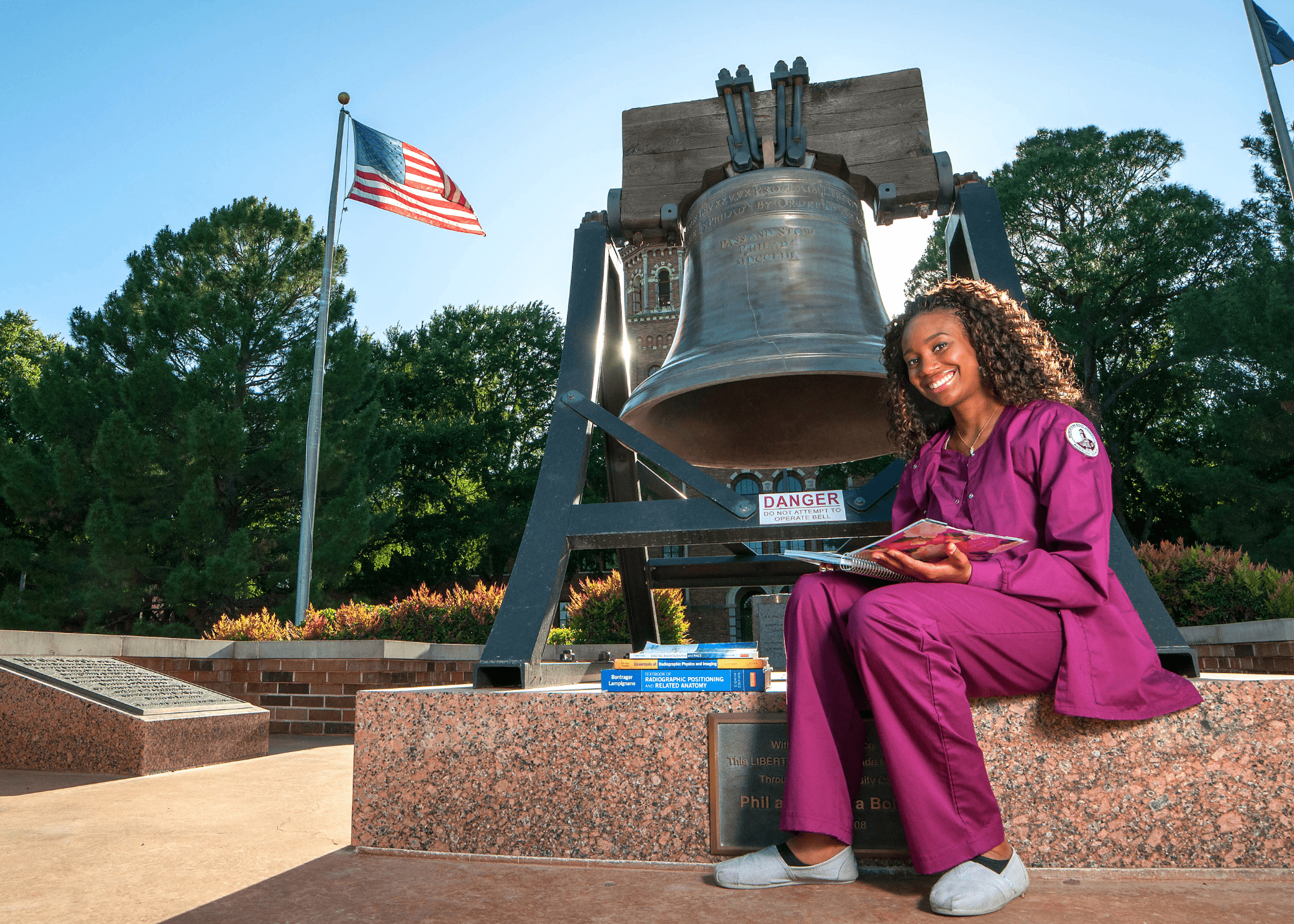 student with bell