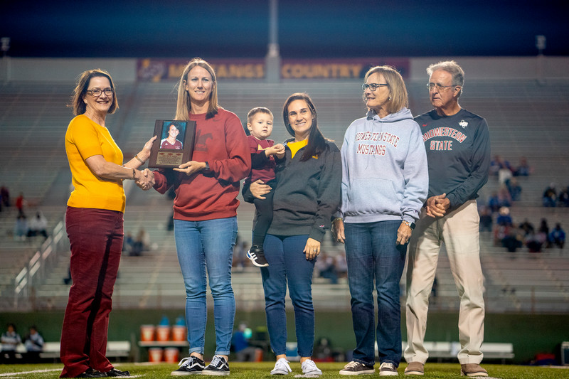 Dr. Haynie presenting a plaque to a group